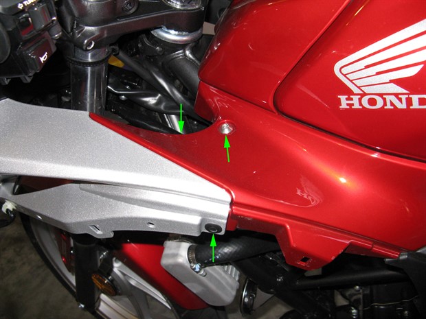 Location of bolt and clips securing fuel tank side cover