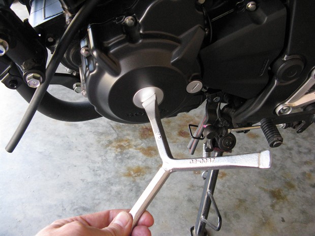 Removing crankshaft hole cap and the timing hole cap