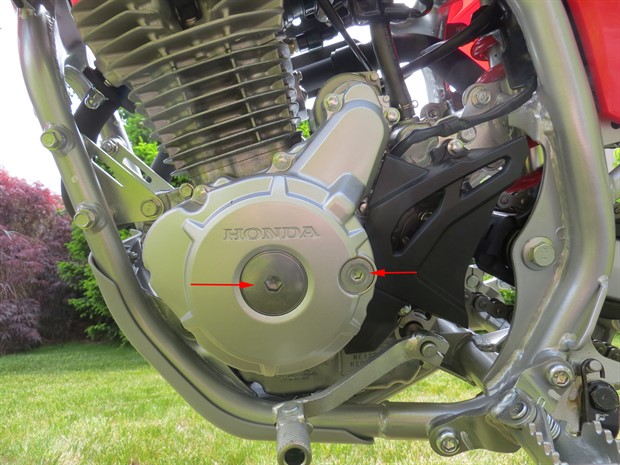 Crankshaft hole cap (centre) and timing hole cap (on right)