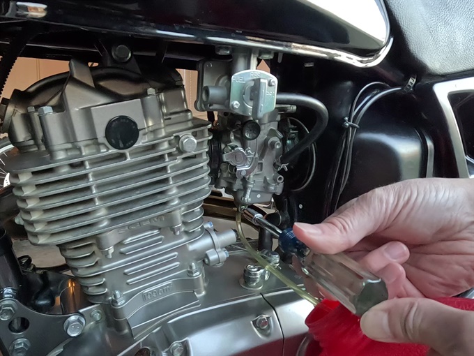Draining the carburetor on a Suzuki DR200SE