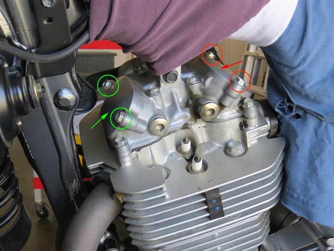 Valve inspection caps (spark plug caps removed from spark plugs)
