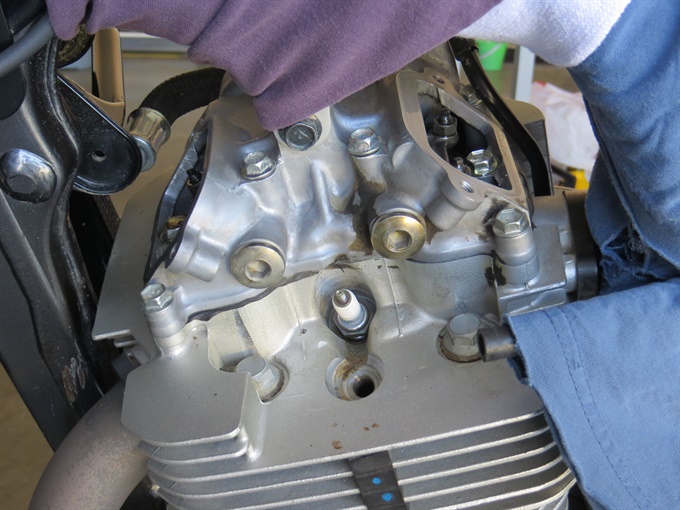 Valve inspection caps removed as well as one spark plug.