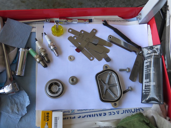 Feeler gauges, tools, spark plugs, valve inspection cap, TDC and generator cover caps