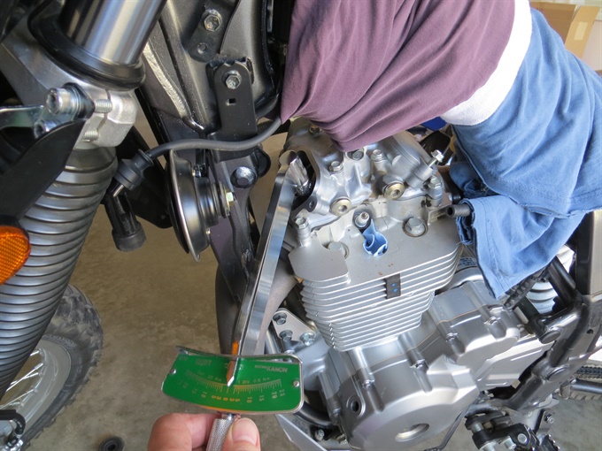 Torquing up the locknut on the valve clearance adjuster (exhaust, left side)