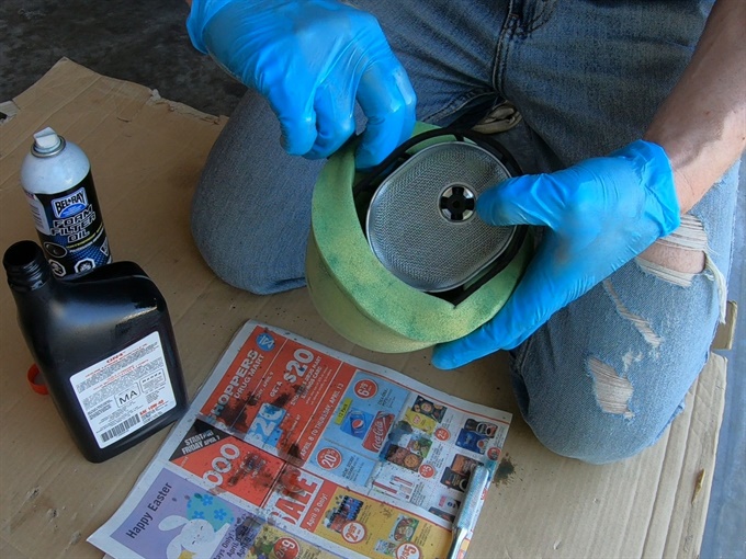 DR200SE - inserting the supporting frame into the air filter
