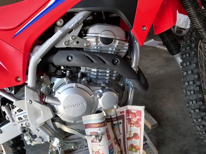 Oil filter cover bolts partially removed - CRF250F