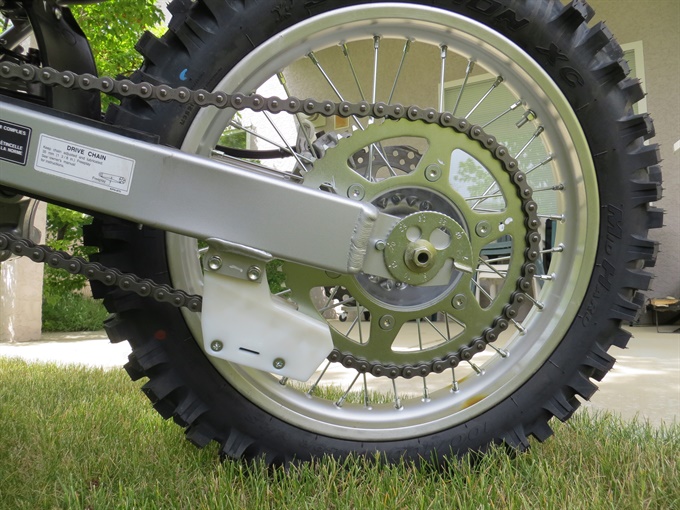 Snail-type chain adjusters on a Honda CRF250F