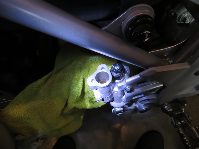 CRF250F rear master cylinder with cap and diaphragm removed.